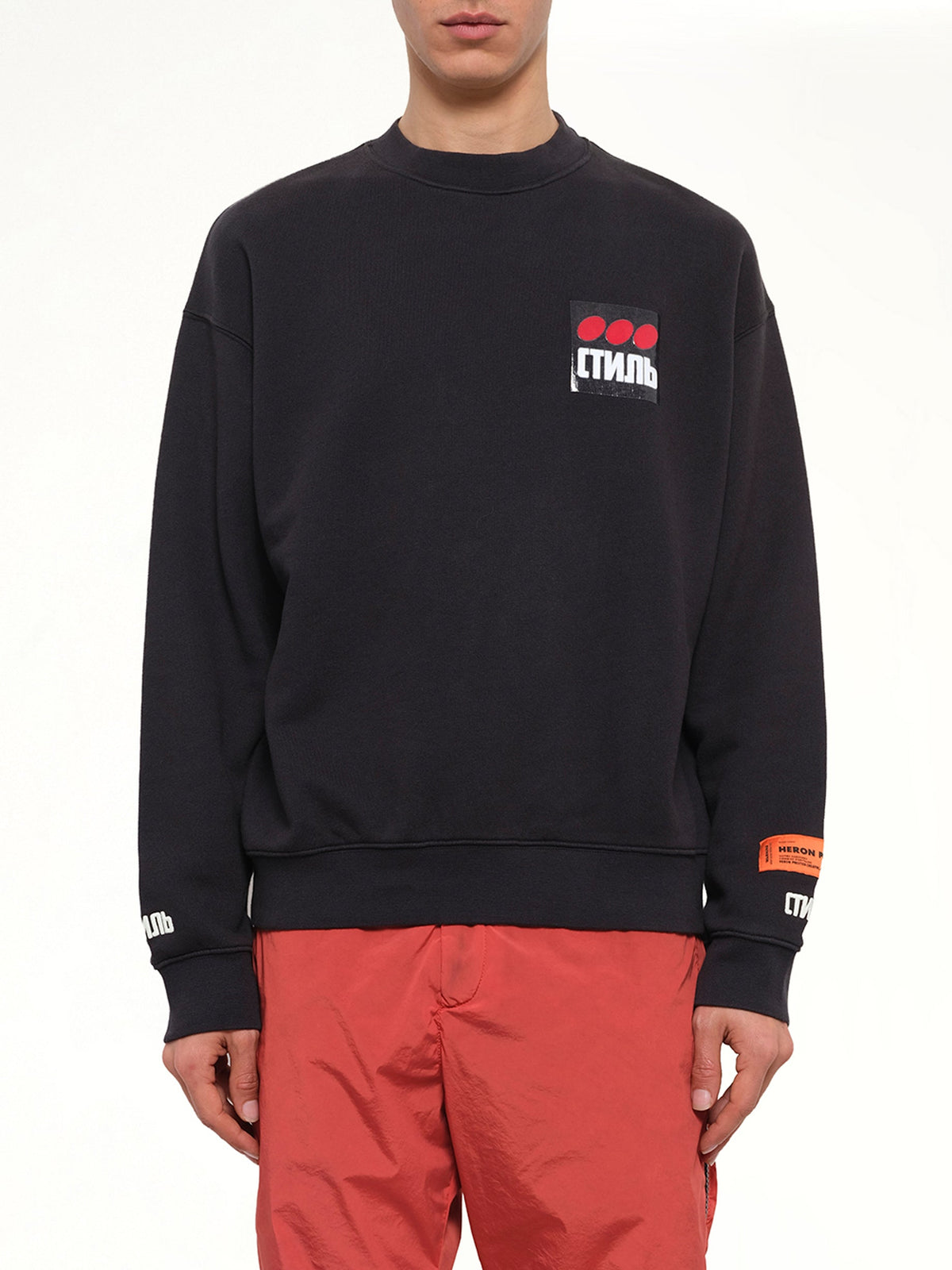Image of a model wearing Outerwear. Product name - CTNMB Sweatshirt in Black colour by brand - HERON PRESTON