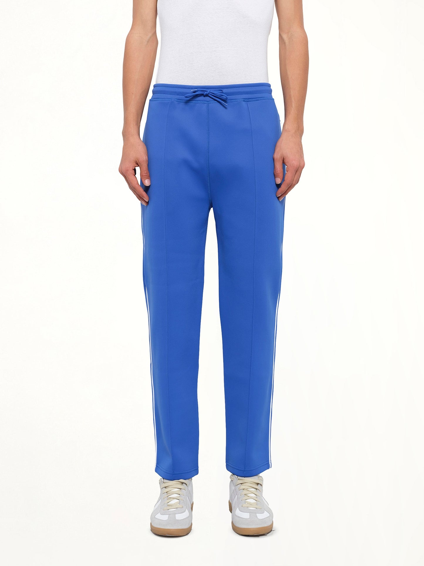 Image of a model wearing Pants. Product name - Drawstrings Jog Pant in Blue colour by brand - KENZO