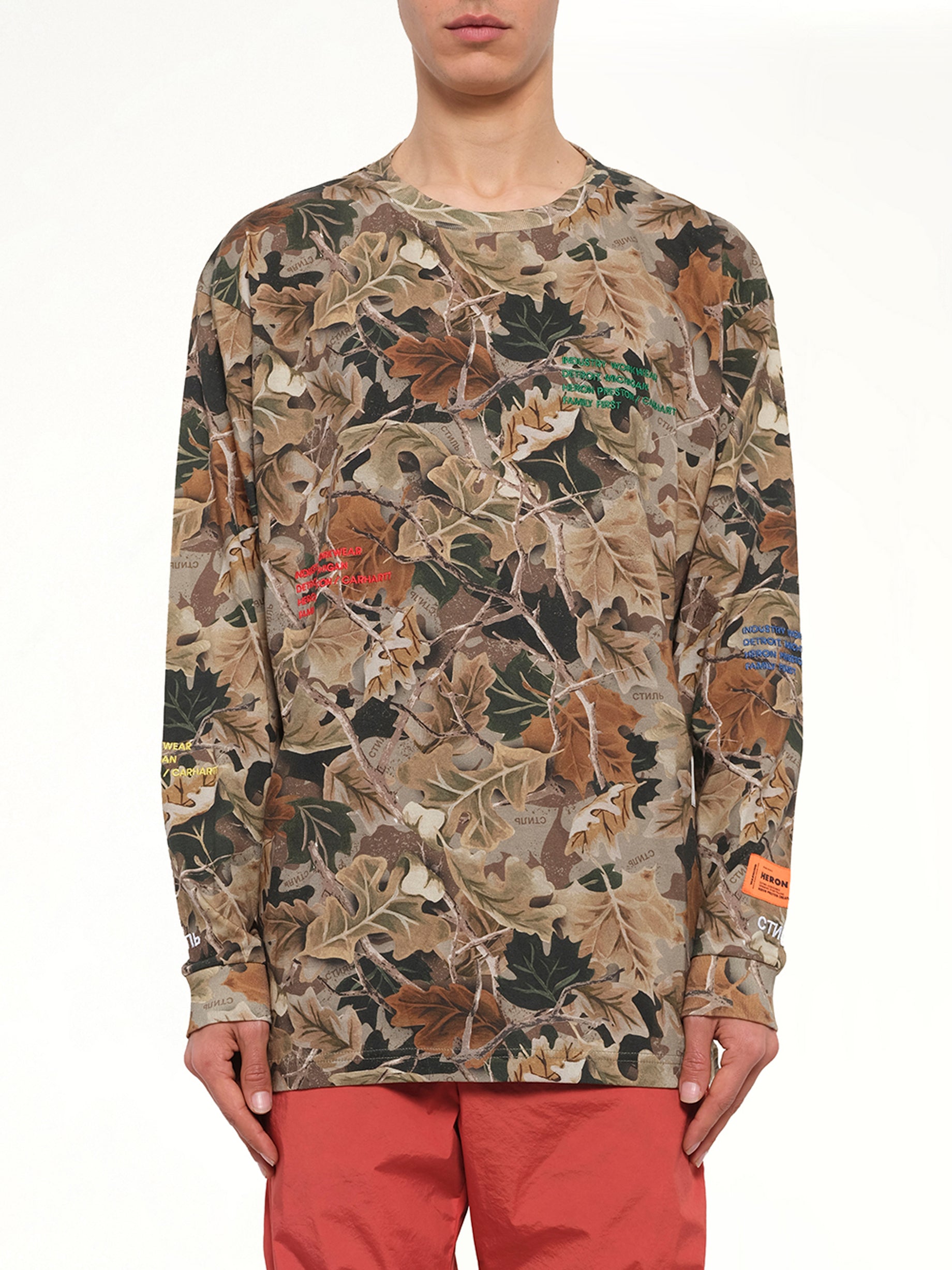 Image of a model wearing Tops. Product name - HP x Carhartt Camo Long Sleeve T-Shirt in Multicolour colour by brand - HERON PRESTON