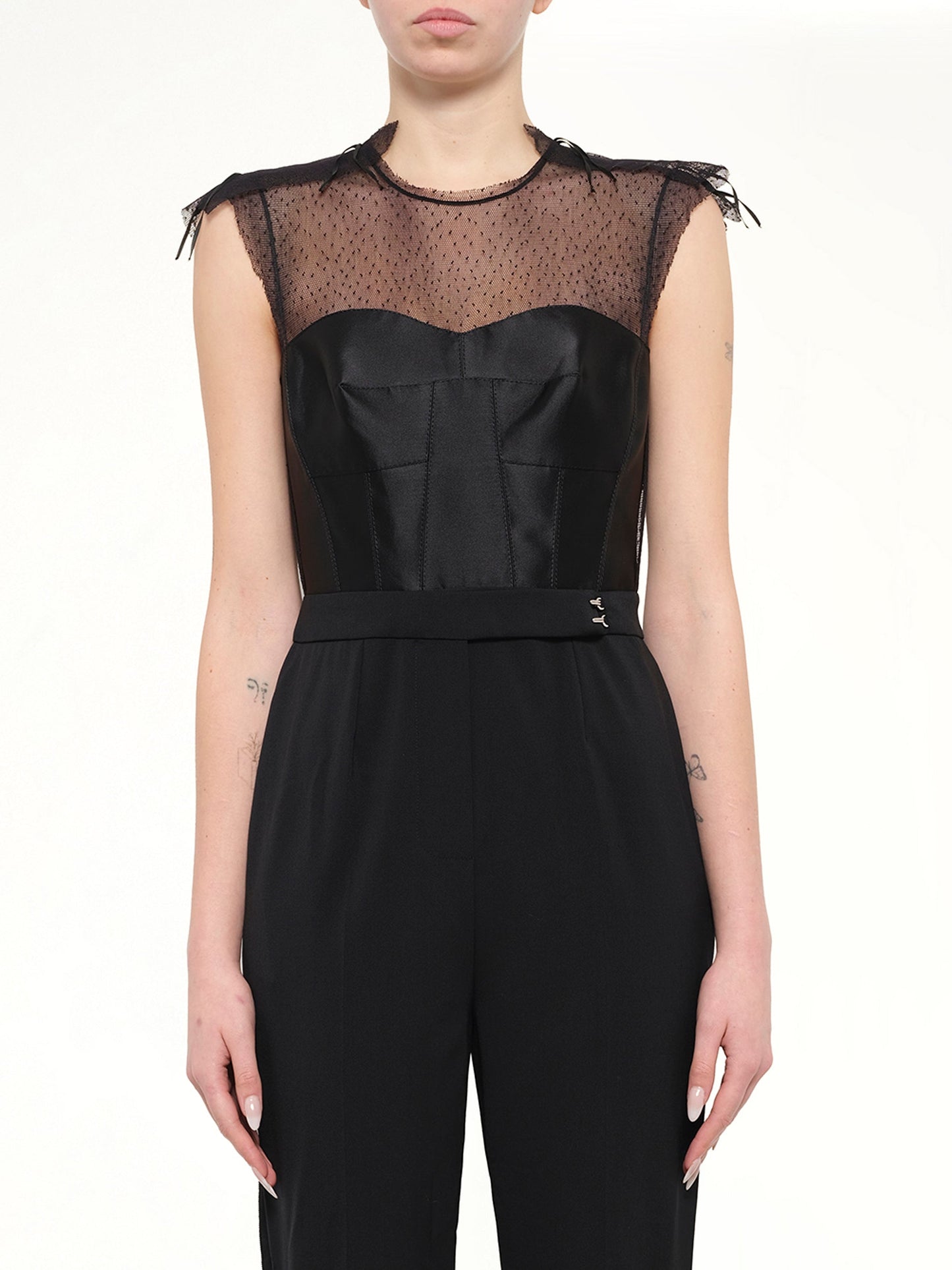 Image of a model wearing Skirts. Product name - Jumpsuit in Black colour by brand - LANVIN