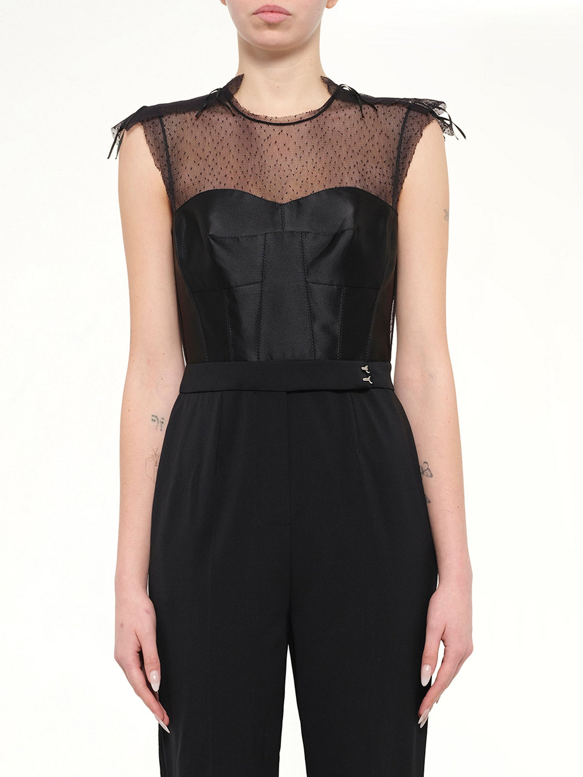 Image of a model wearing Skirts. Product name - Jumpsuit in Black colour by brand - LANVIN