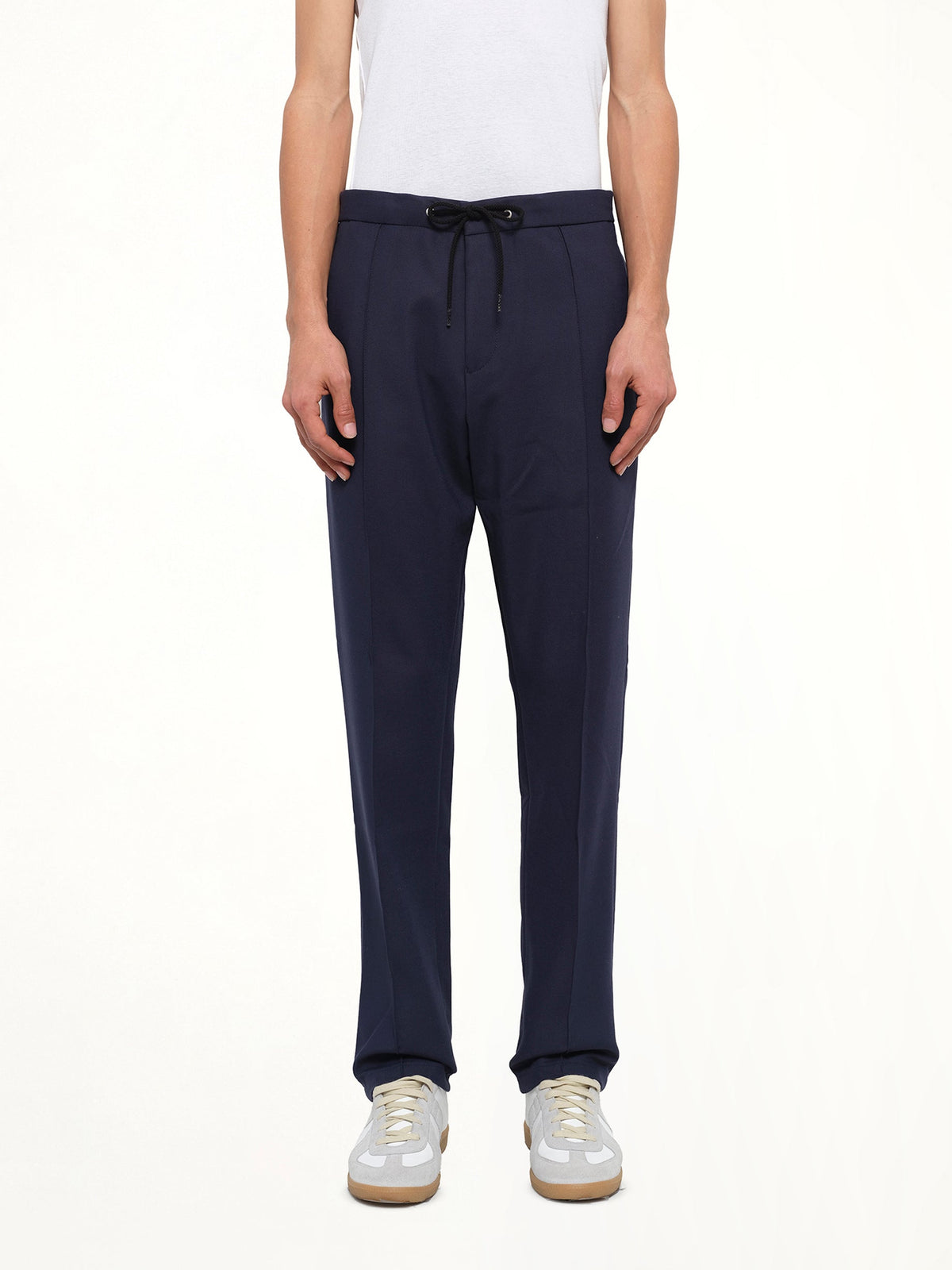 Image of a model wearing Pants. Product name - Kenzo Track Pant in Blue colour by brand - KENZO