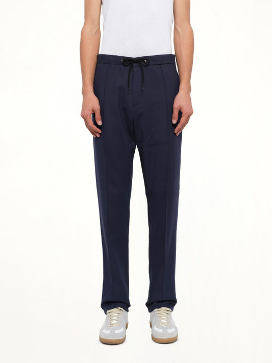Image of a model wearing Pants. Product name - Kenzo Track Pant in Blue colour by brand - KENZO