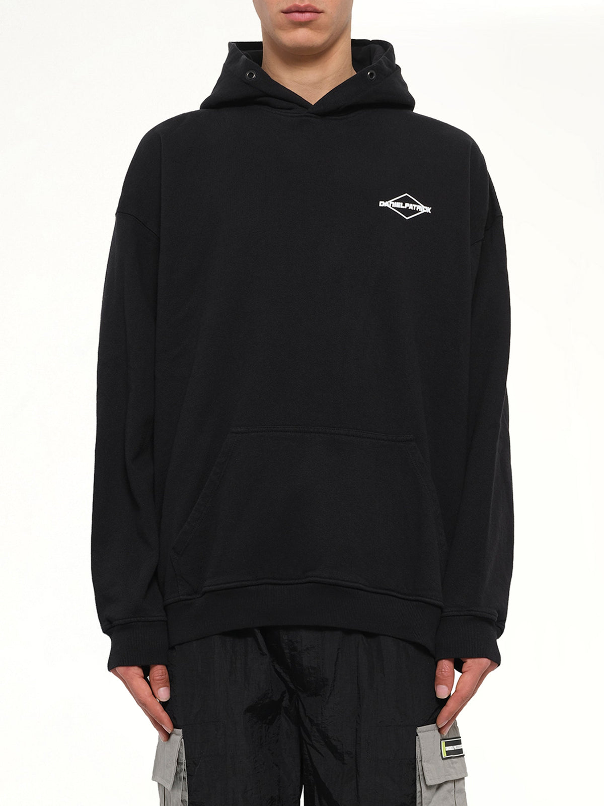 Image of a model wearing Outerwear. Product name - Take Care Hoodie in Black colour by brand - DANIEL PATRICK