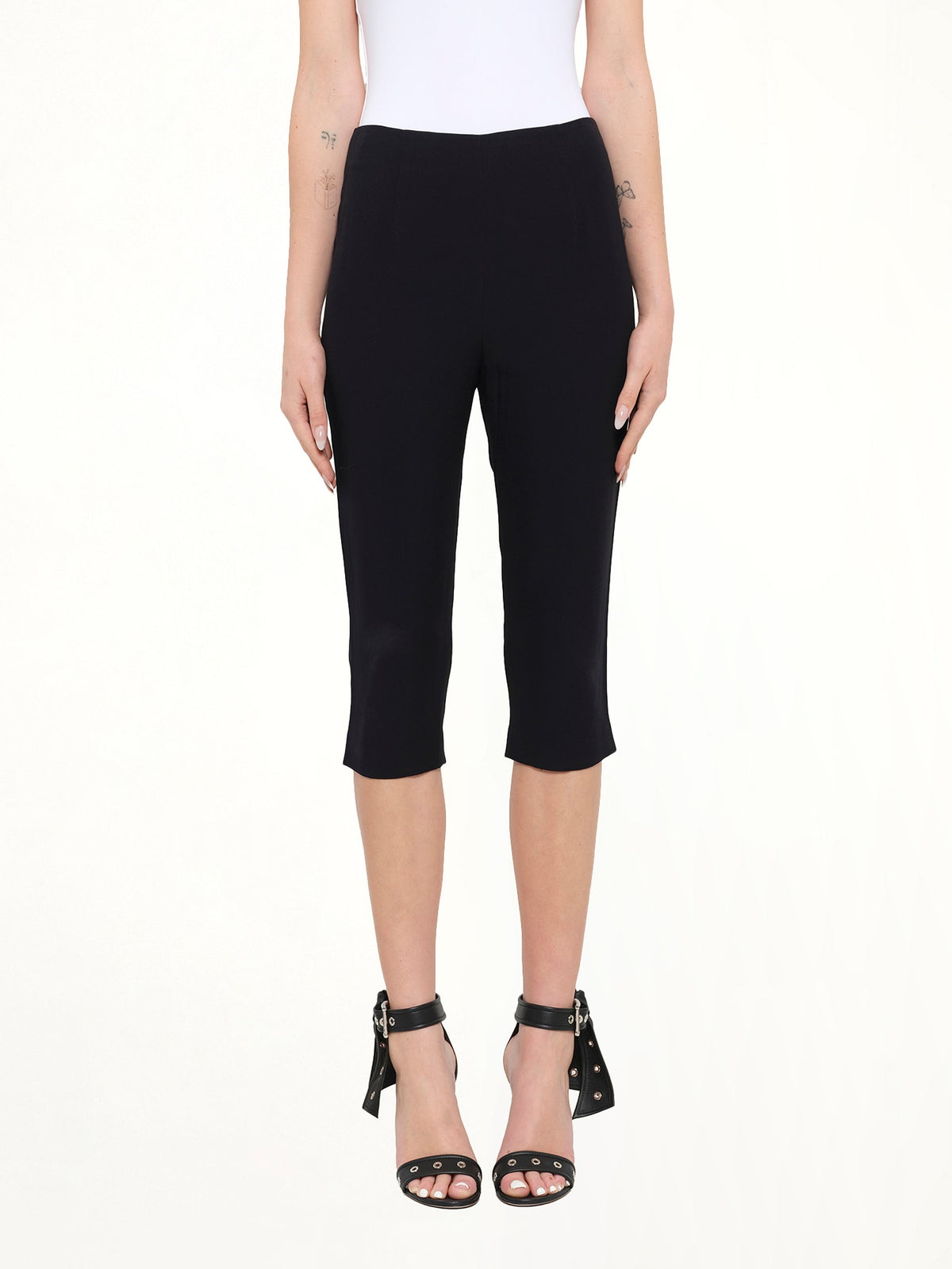 Image of a model wearing Pants. Product name - Alexander McQueen Pants in Black colour by brand - ALEXANDER MCQUEEN