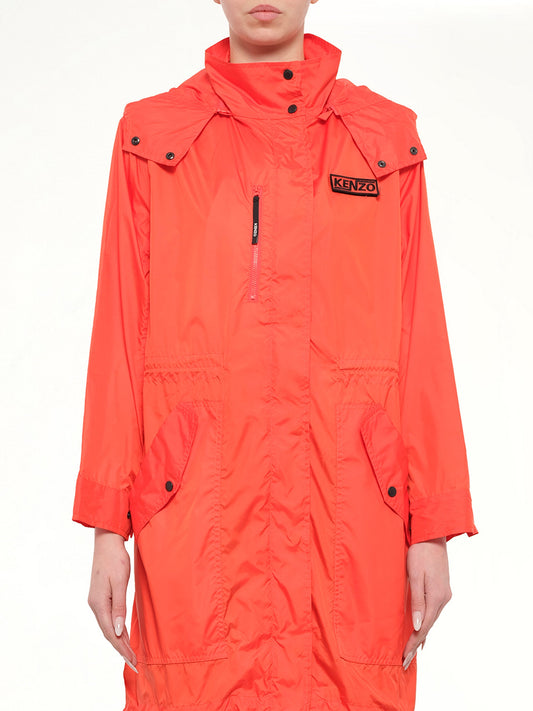 Image of a model wearing Rain Coats. Product name - Hooded Raincoat in Red colour by brand - KENZO