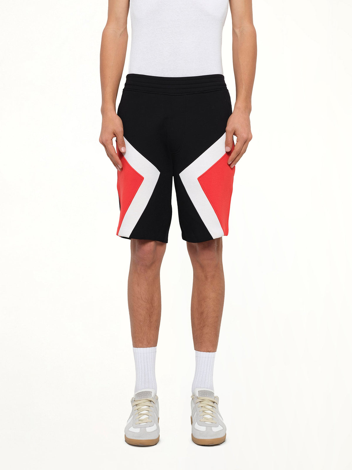 Image of a model wearing Pants. Product name - Knit Pants in Bk/Cf/Re colour by brand - NEIL BARRETT