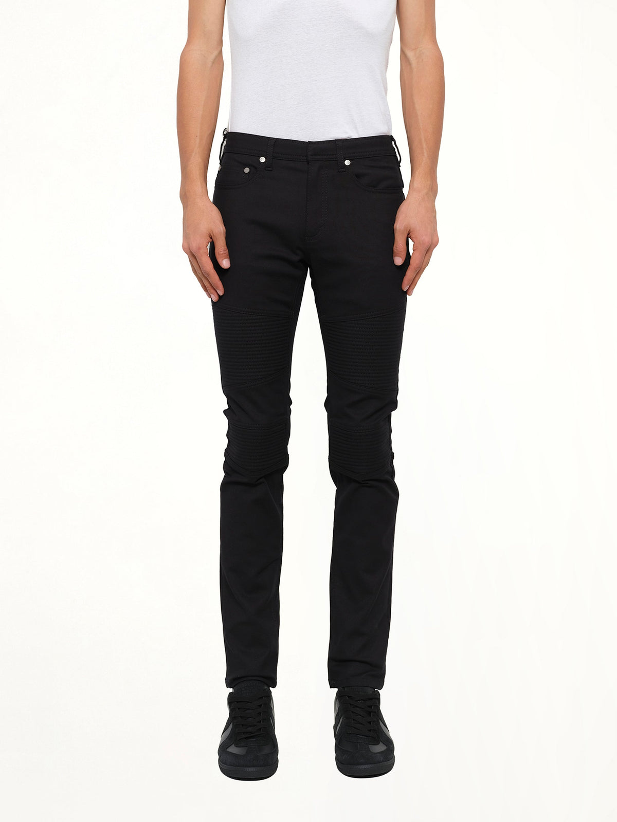 Image of a model wearing Pants. Product name - Neil Barrett Pants in Black colour by brand - NEIL BARRETT