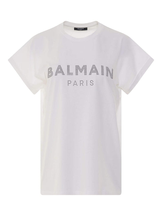 Image of a model wearing Tops. Productname: BALMAIN Short Sleeve Rhinestone Logo T-Shirt in WHITE colour by brand - BALMAIN
