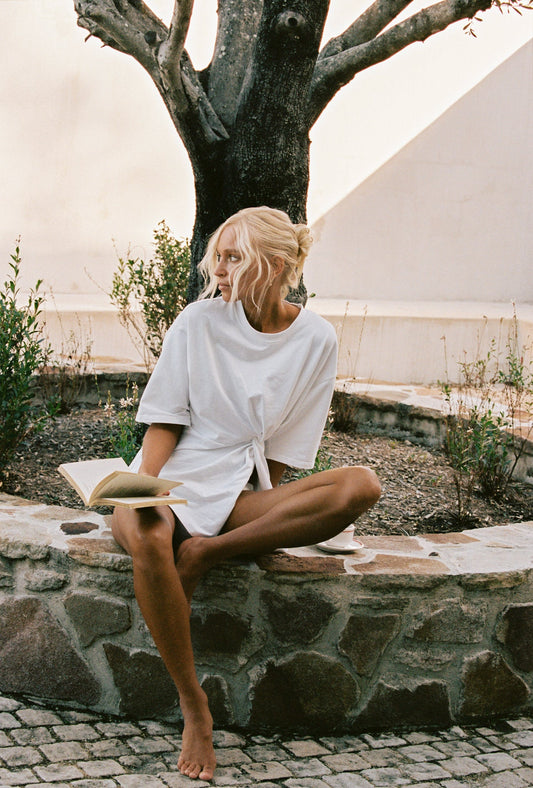 Image of a model wearing Tops. Productname: SNDYS ZAIRA KNOT T-SHIRT in White colour by brand - SNDYS