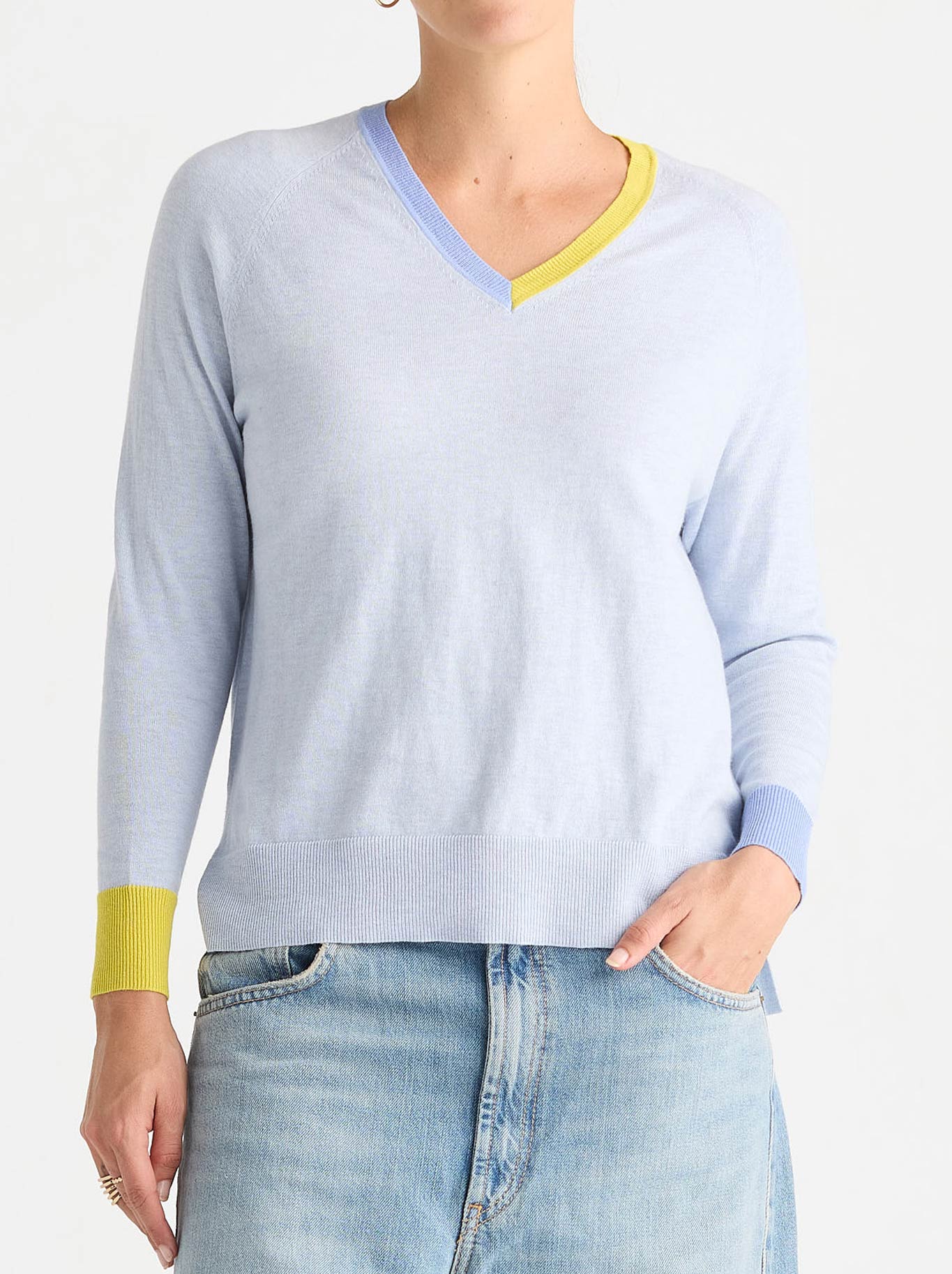 Image of a model wearing Outerwear. Product name - Zaket & Plover V Accent Knit in Clear Sky colour by brand - Zaket And Plover