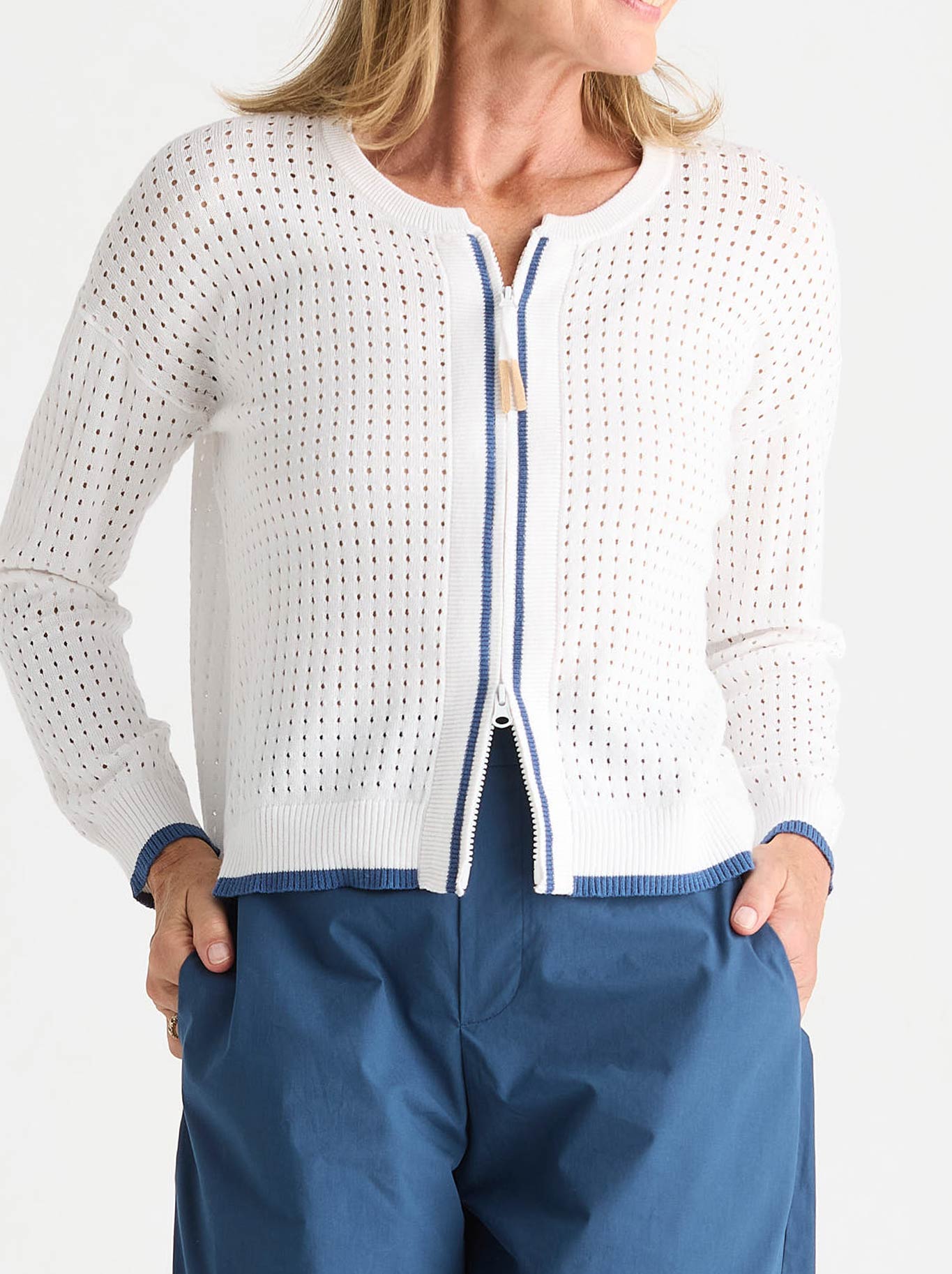 Image of a model wearing Outerwear. Product name - Zaket & Plover Pointelle Zip Cardi in White colour by brand - Zaket And Plover