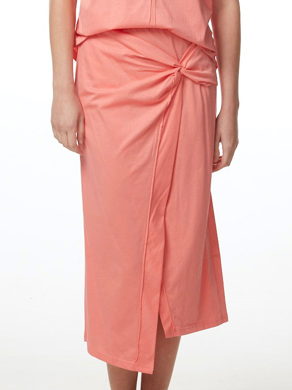 Image of a model wearing Skirts. Product name - ZAKET & PLOVER T SKIRT in Coral colour by brand - Zaket And Plover