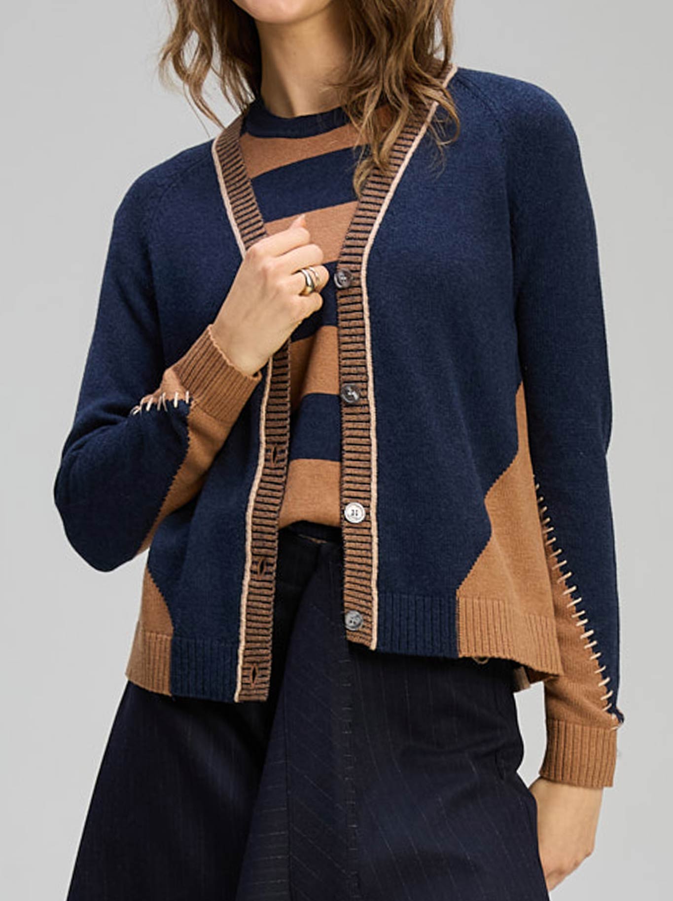 Image of a model wearing Outerwear. Productname: Zaket & Plover Dual Stitch Cardi in Cinnamon colour by brand - Zaket And Plover