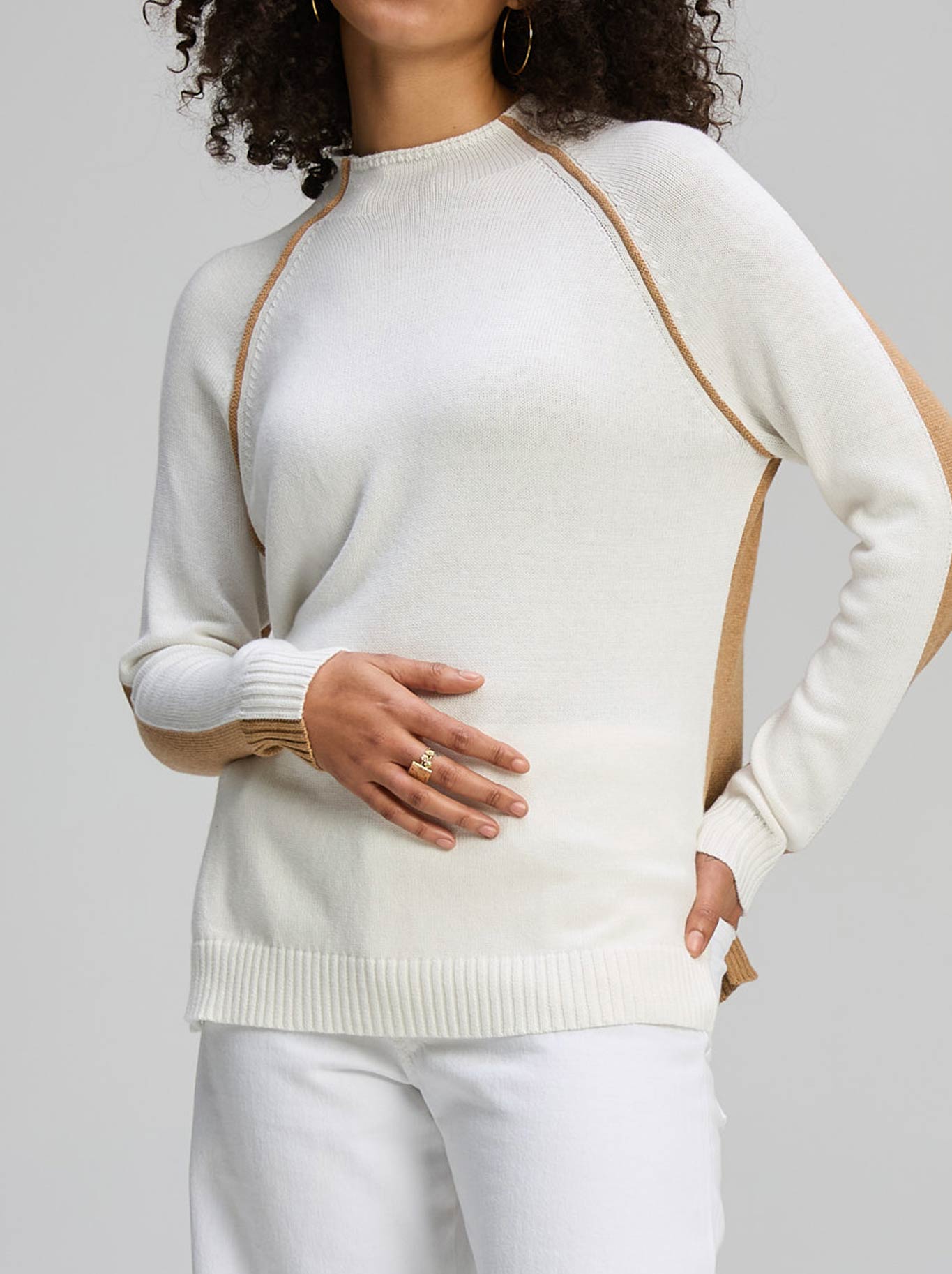 Image of a model wearing Outerwear. Product name - ZAKET & PLOVER TWO WAY FUNNEL KNIT in White colour by brand - Zaket And Plover