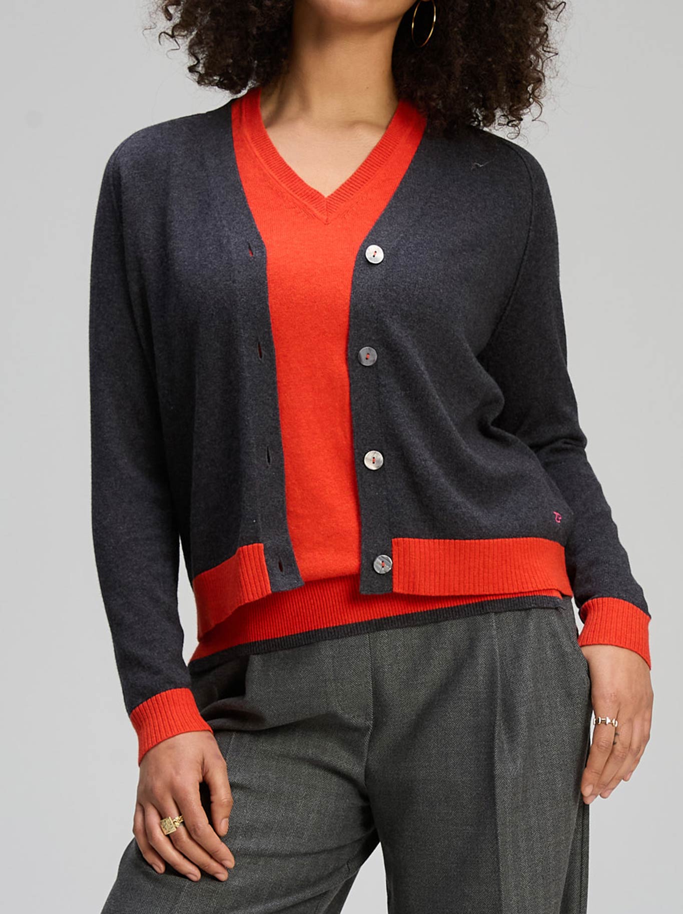 Image of a model wearing Outerwear. Product name - ZAKET & PLOVER ESSENTIAL V NECK CARDI in Basil colour by brand - Zaket And Plover