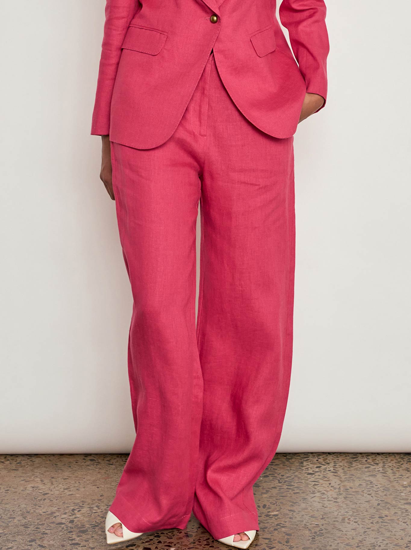 Image of a model wearing Pants. Product name - ZOE KRATZMANN EDIT PANT in Rhubarb colour by brand - Zoe Kratzmann