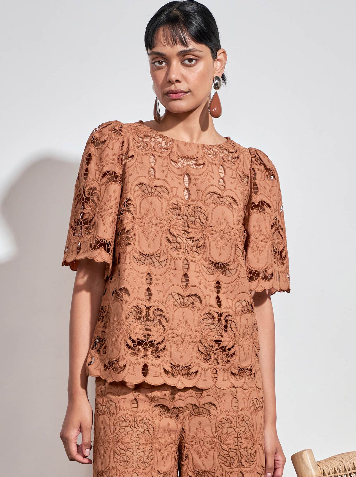 Image of a model wearing Tops. Product name - ZOE KRATZMANN RESOLVE TOP in Alabaster colour by brand - Zoe Kratzmann