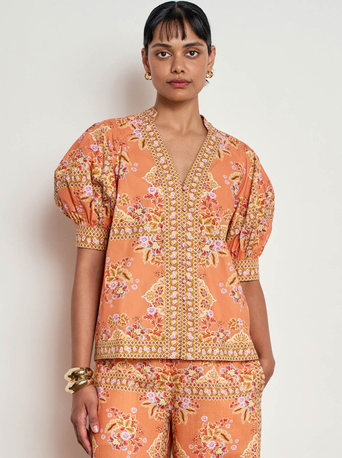 Image of a model wearing Tops. Product name - ZOE KRATZMANN SIENNE TOP in Marigold Prt colour by brand - Zoe Kratzmann