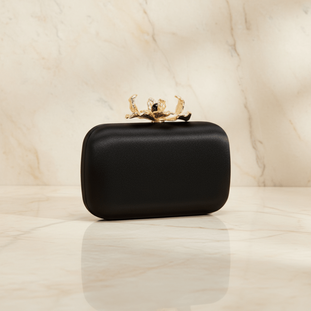 Image of Bags. Product name - ADELE Orchid Lock Clutch in Black colour by brand - Olga Berg