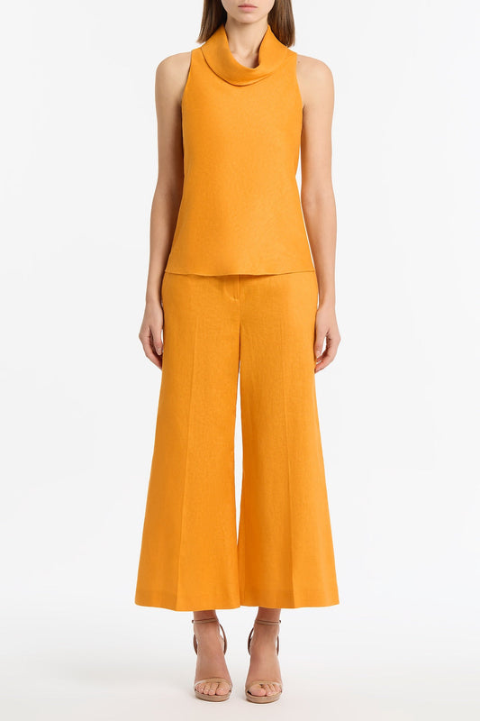 Image of a model wearing Tops. Productname: Amber Linen Folded Collar Top in Orange colour by brand - Carla Zampatti