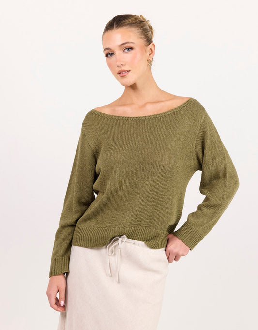 Image of a model wearing Outerwear. Product name - Eventide Boat Neck Long Sleeve Jumper Sage in Sage colour by brand - Among The Brave