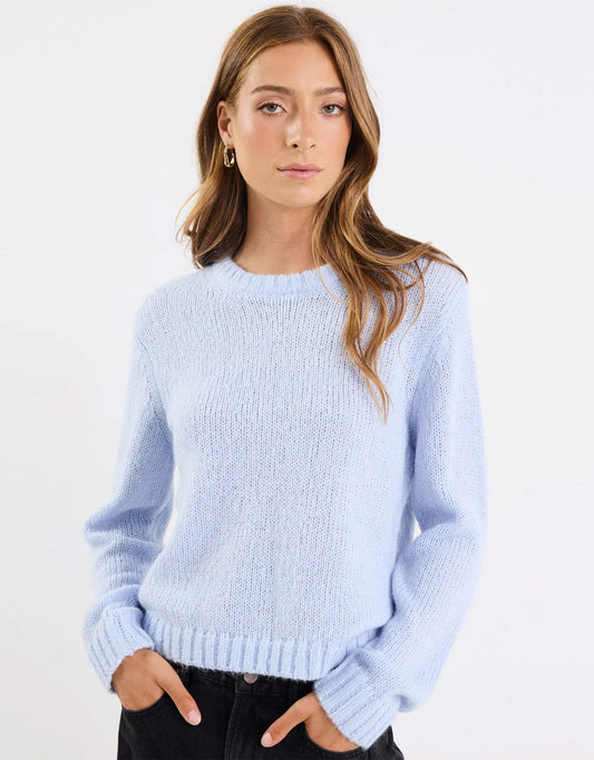 Image of a model wearing Outerwear. Product name - Genuine Crewneck Fluffy Long Sleeve Jumper Ice Blue in Ice Blue colour by brand - Among the Brave