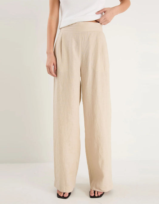 Image of a model wearing Pants. Productname: Guardian Linen Pull On Wide Leg Pants - in Stone colour by brand - Among the Brave