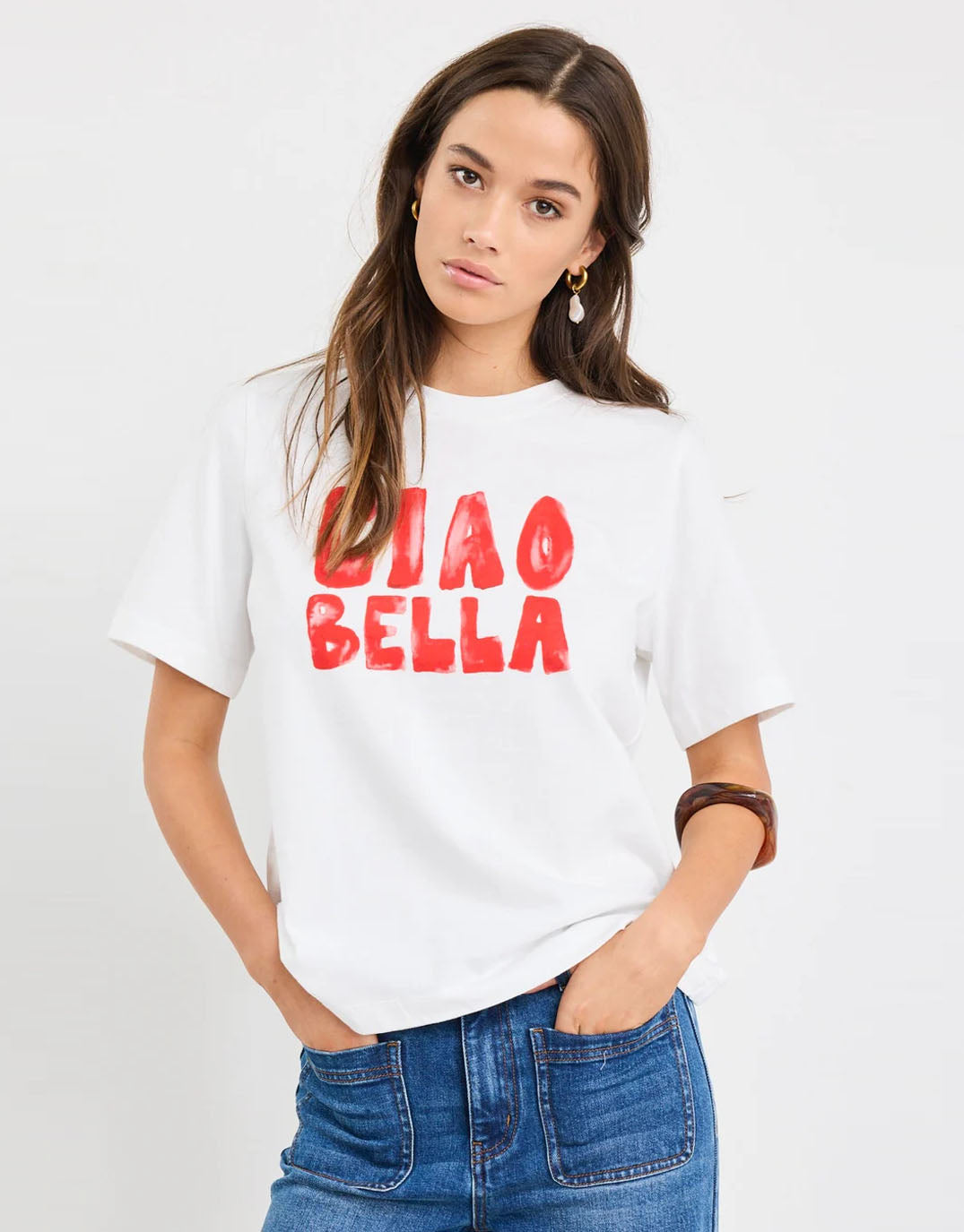Image of a model wearing Tops. Productname: Paradiso Boxy Tee - / Ciao Print in Ivory colour by brand - Among the Brave