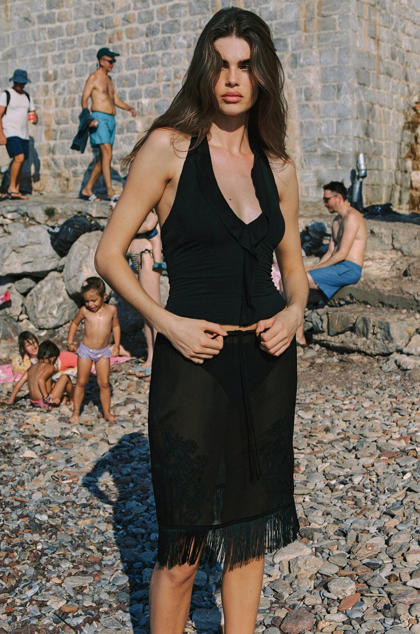 Image of a model wearing Skirts. Product name - Andie Skirt in Black colour by brand - With Jéan