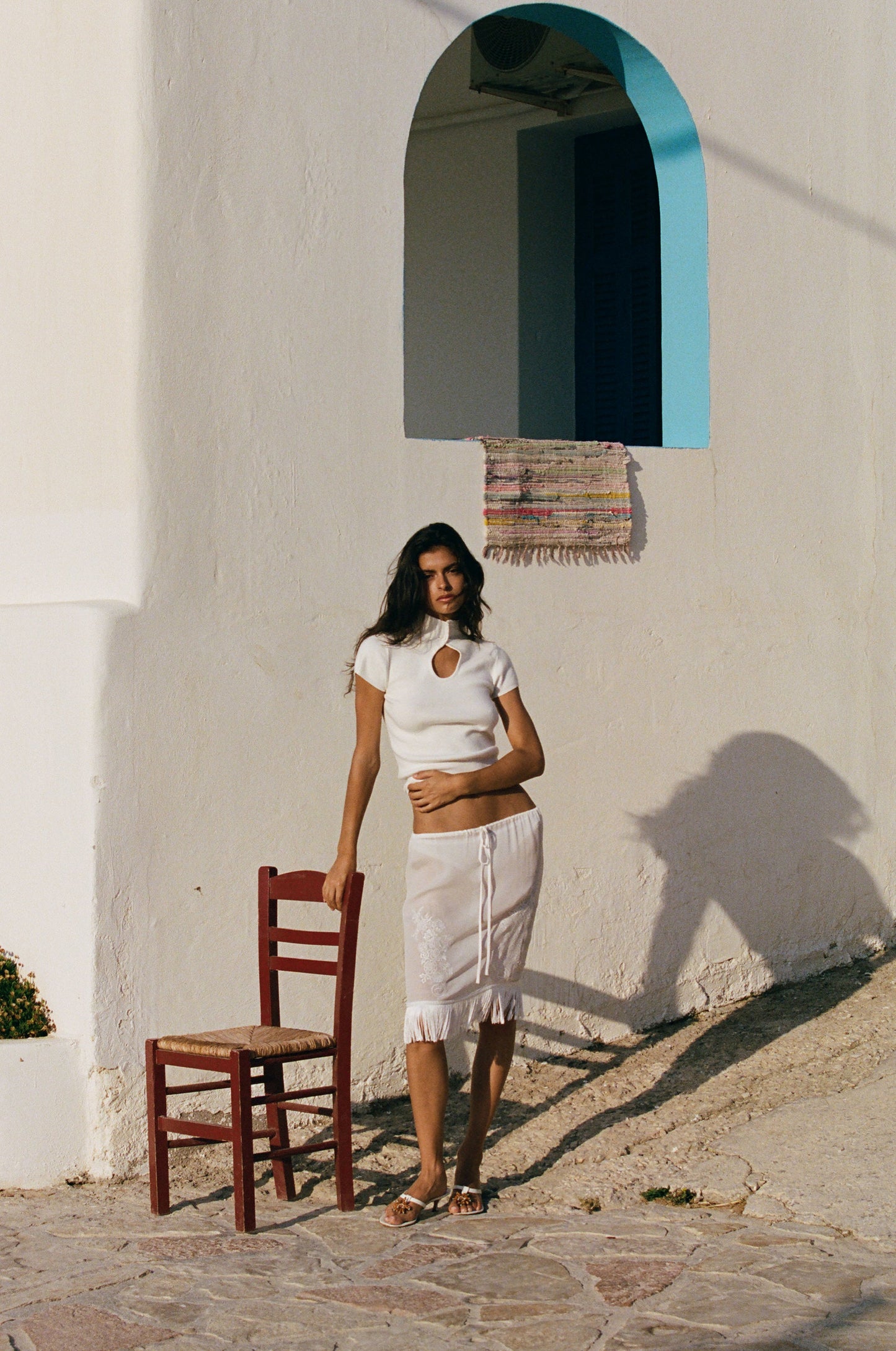 Image of a model wearing Skirts. Product name - Andie Skirt in White colour by brand - With Jéan