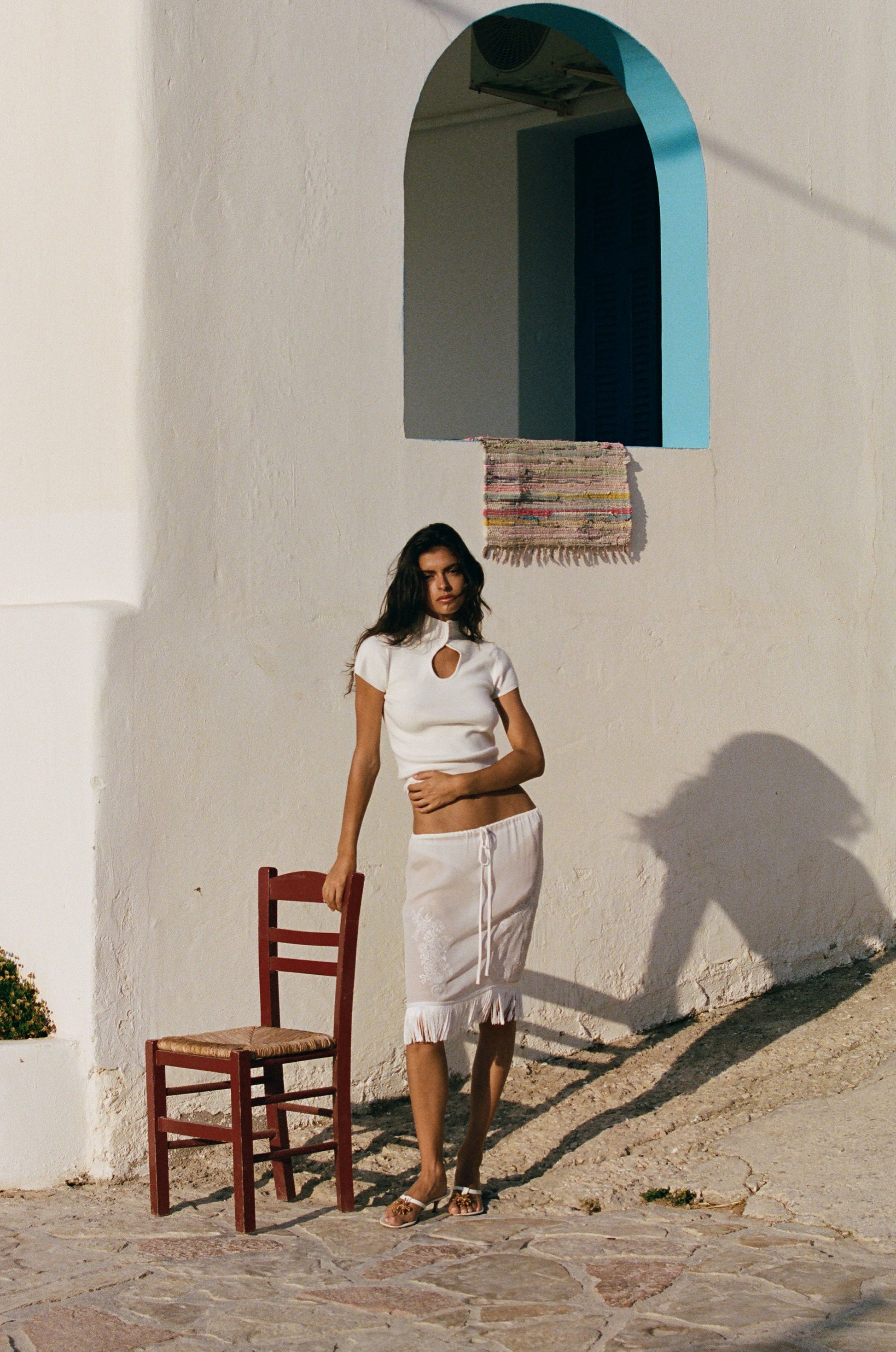 Image of a model wearing Skirts. Product name - Andie Skirt in White colour by brand - With Jéan