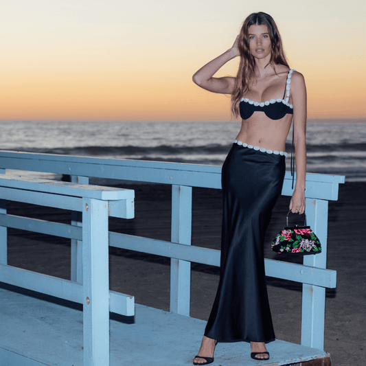 Image of a model wearing Tops. Productname: AUDREY Sequin Top Handle in colour by brand - Olga Berg