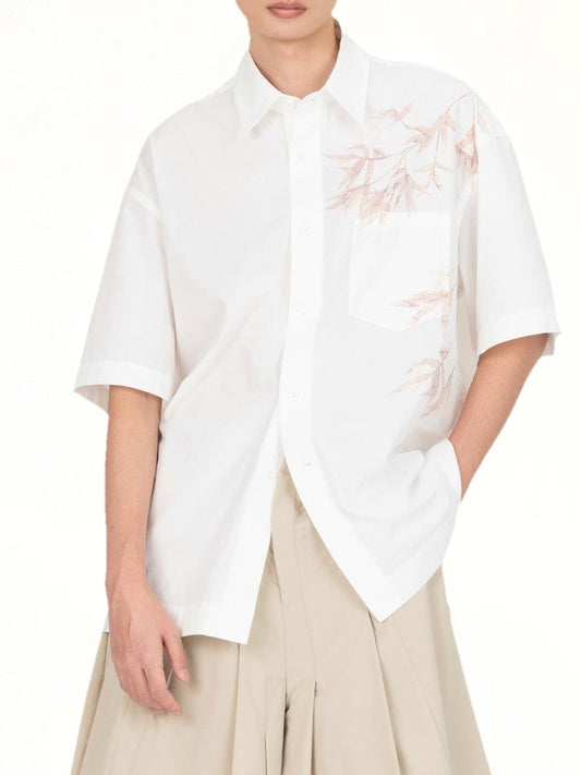 Image of a model wearing Tops. Product name - Bamboo Printed Short Sleeve Shirt in White colour by brand - FENG CHEN WANG