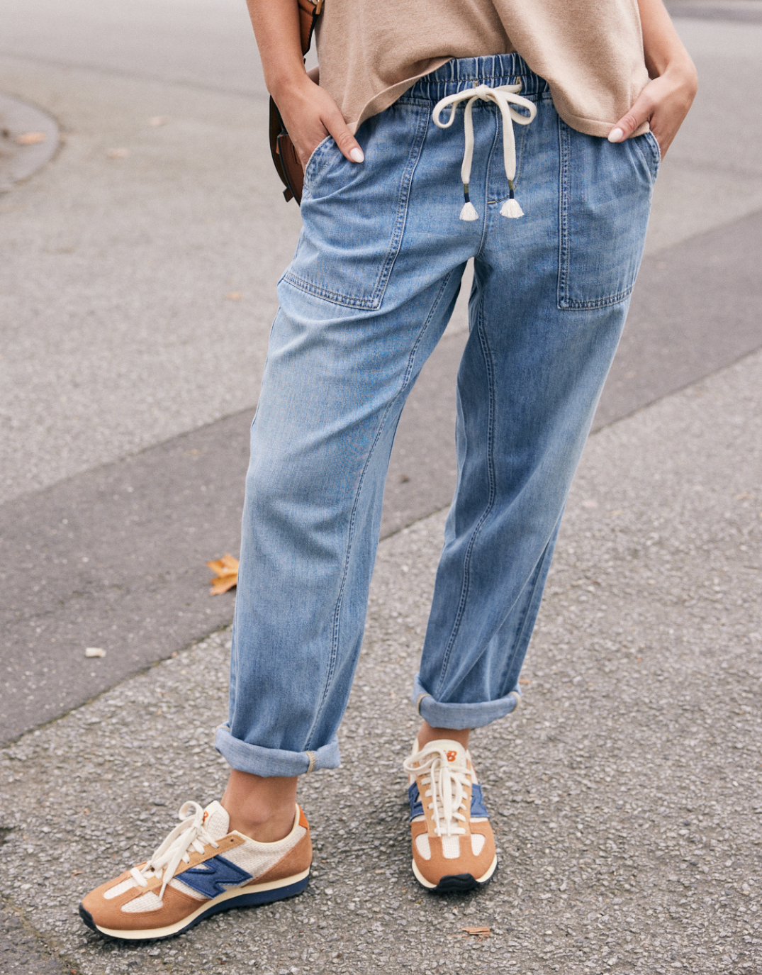 Image of a model wearing Pants. Product name - Beach Comber Pant Mid Wash in Mid Wash colour by brand - White & Co.