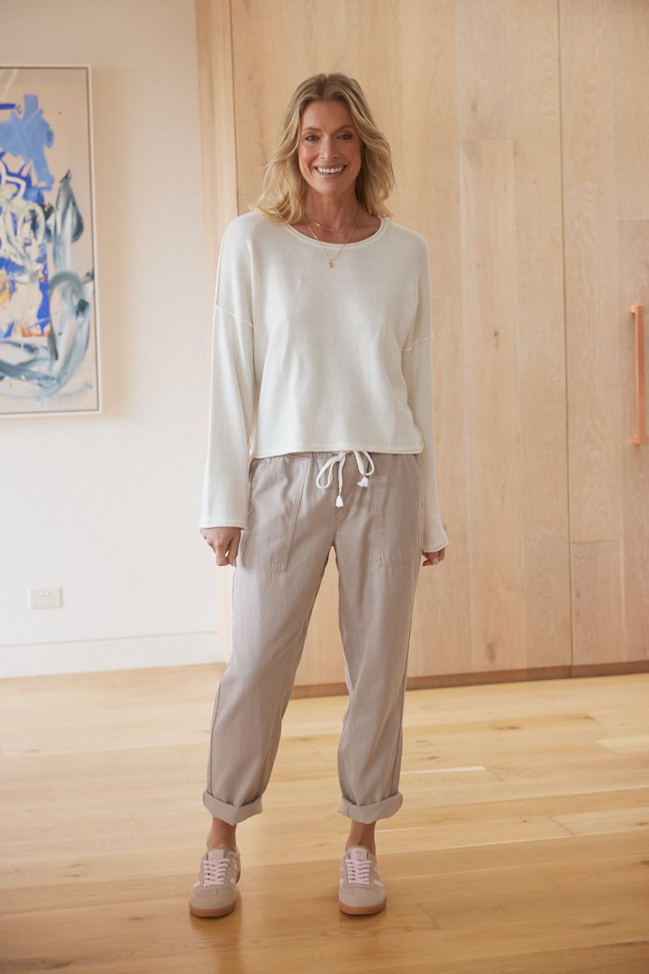 Image of a model wearing Pants. Product name - Beach Comber Pant Stone in Stone colour by brand - White & Co.