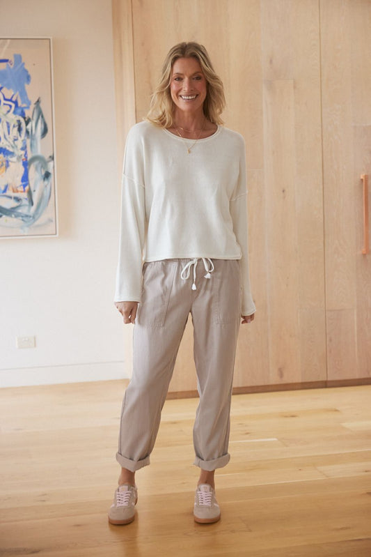 Image of a model wearing Pants. Product name - Beach Comber Pant Stone in Stone colour by brand - White & Co.