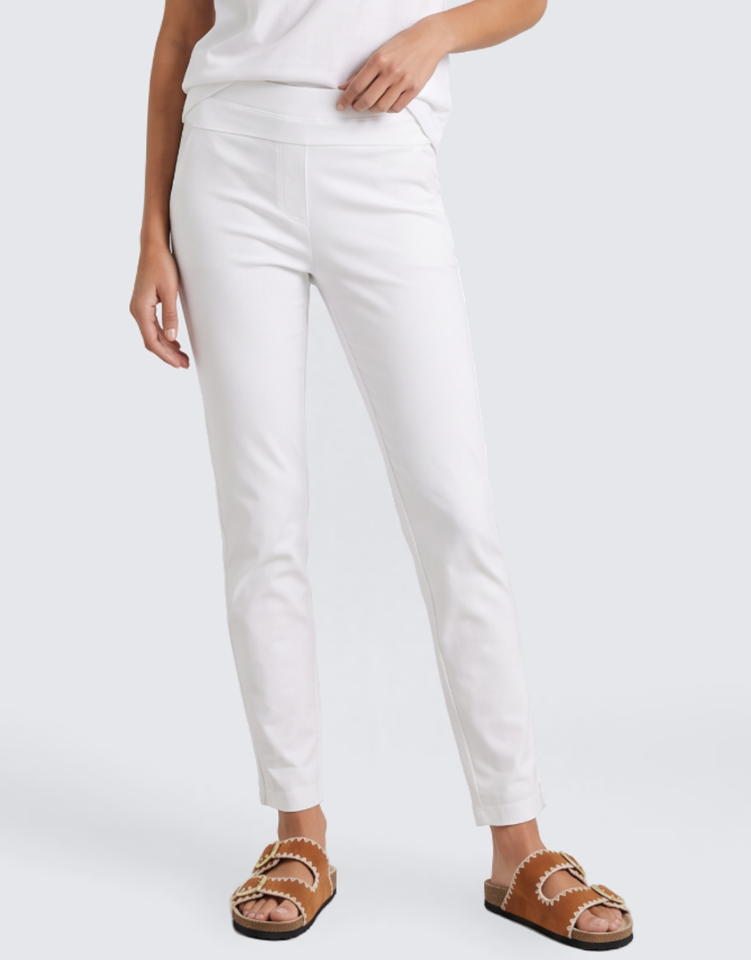 Image of a model wearing Pants. Product name - The 24/7 Bengaline Crop Pant White in White colour by brand - Tirelli