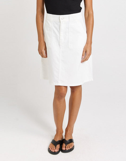 Image of a model wearing Skirts. Product name - Aida Denim Skirt White in White colour by brand - Betty Basics
