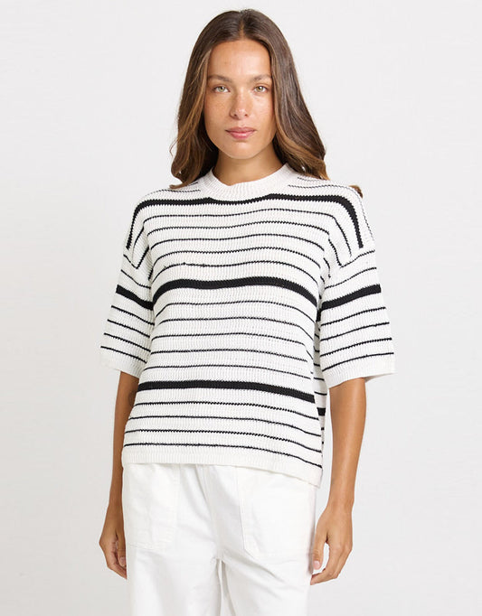 Image of a model wearing Outerwear. Product name - Dylan Knit Tee White/Black Stripe in White/Black Stripe colour by brand - Betty Basics