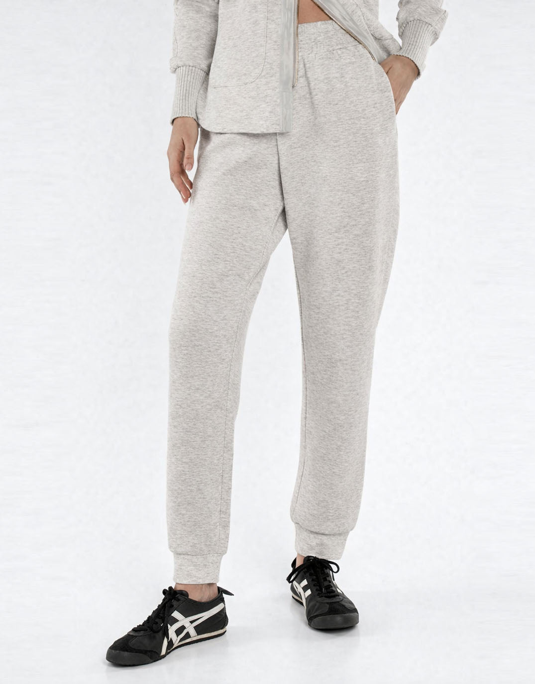 Image of a model wearing Pants. Product name - Sabina Trackpant Grey Marle in Grey Marle colour by brand - Betty Basics