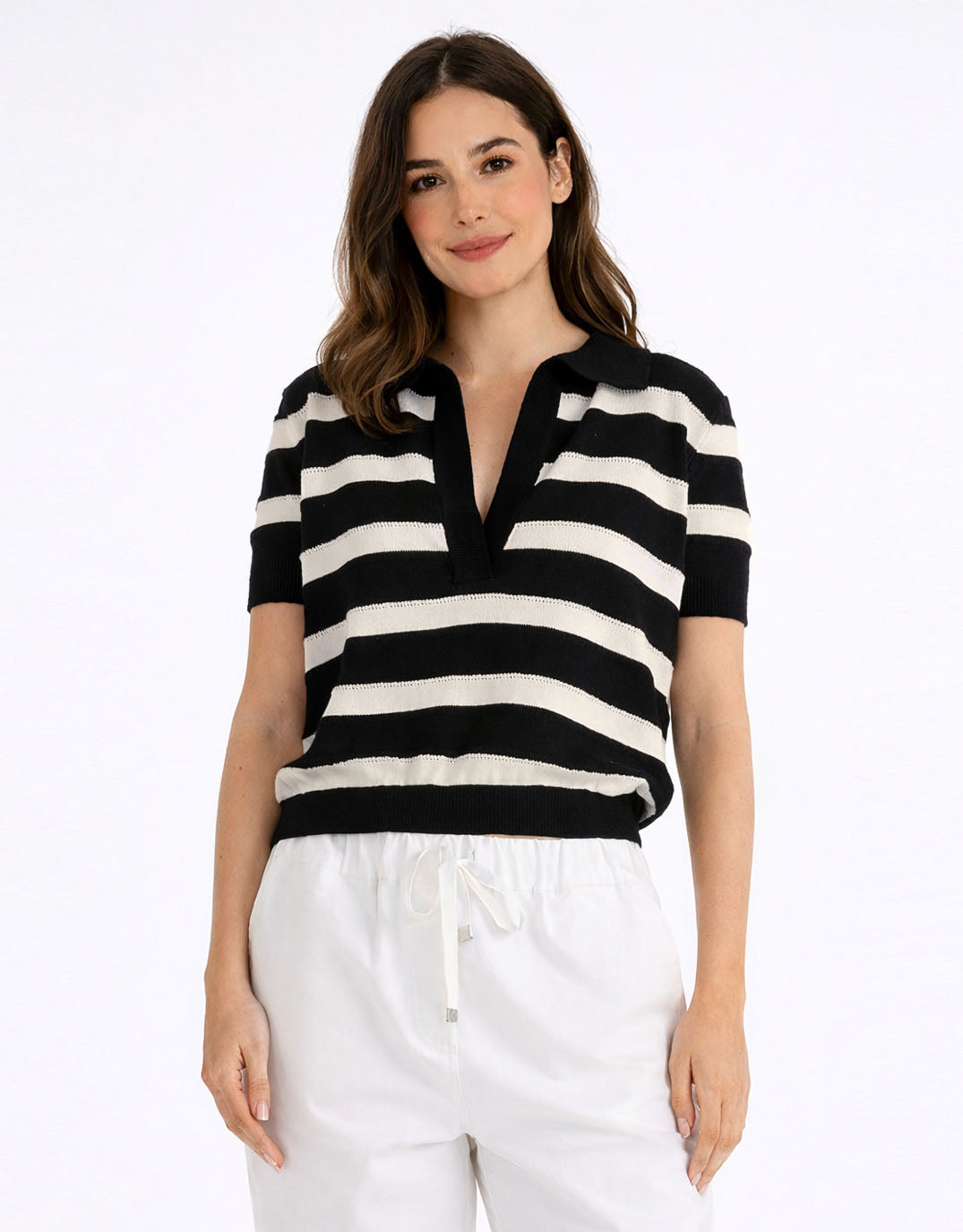 Image of a model wearing Tops. Product name - Salford Knit Polo Cream/Black in Cream/Black colour by brand - Betty Basics