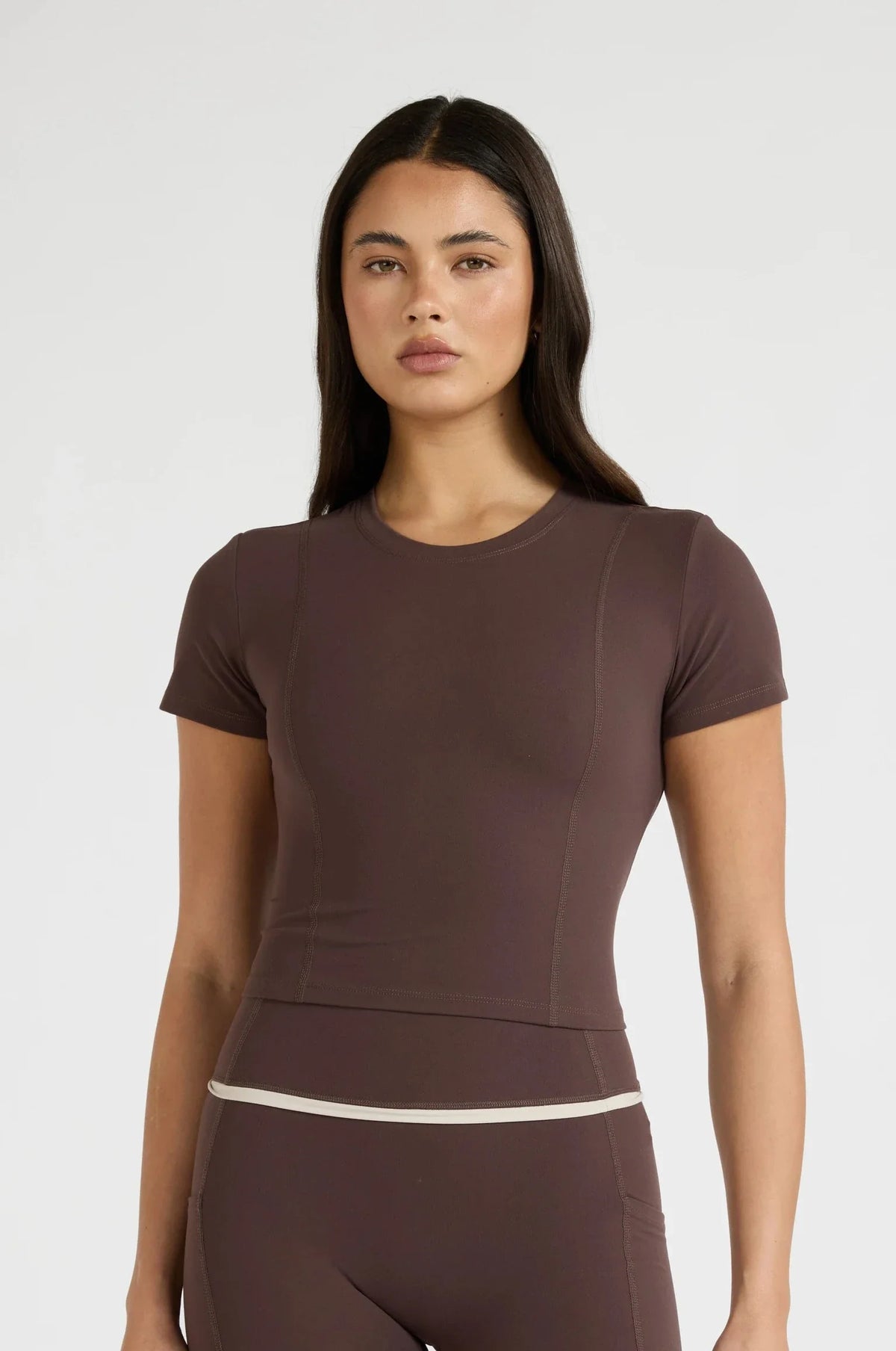 Image of T-Shirts. Product name - ALLFENIX CloudCore Lite Crop Tee in Espresso colour by brand - All Fenix