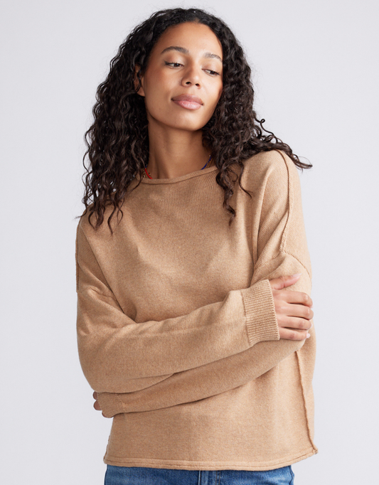 Image of a model wearing Outerwear. Product name - Biarritz Raw Edge Knit Mocha in Mocha colour by brand - White & Co.