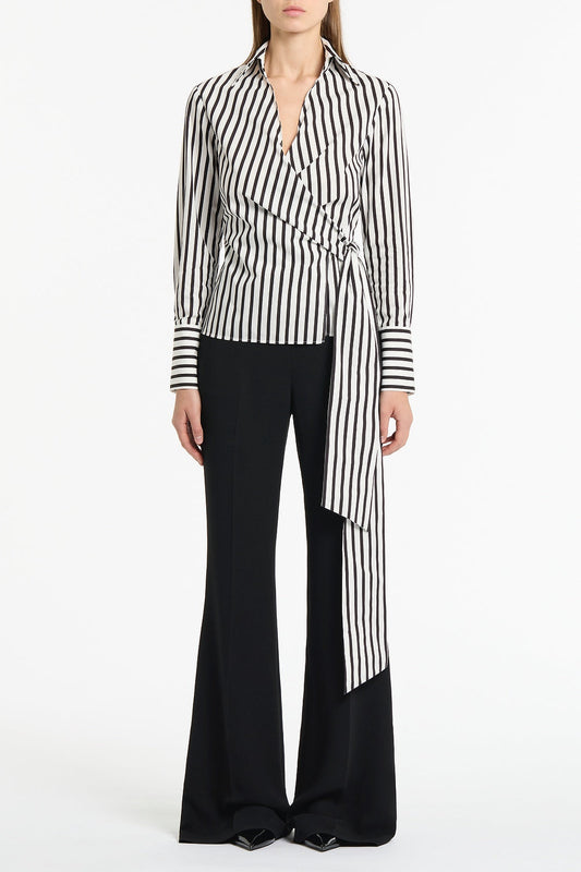 Image of a model wearing Tops. Product name - Black And White Stripe Cotton Wrap Top in Black colour by brand - Carla Zampatti