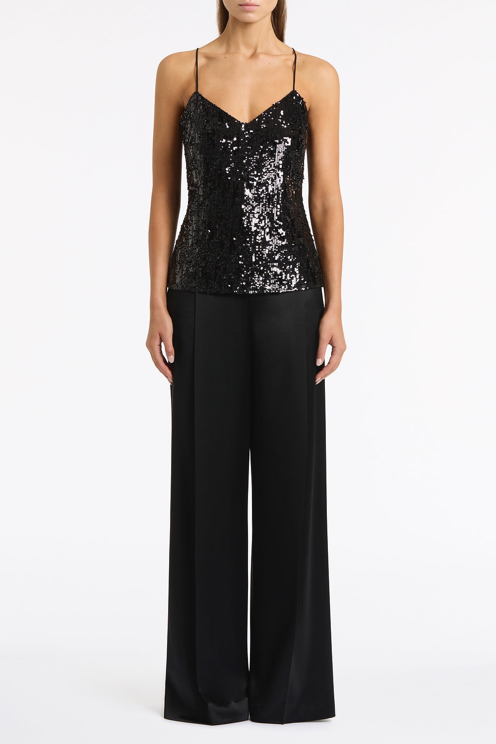 Image of a model wearing Tops. Product name - Black Cascade Sequin Thin Strap Top in Black colour by brand - Carla Zampatti