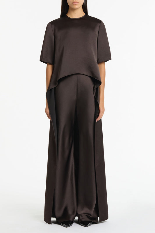 Image of a model wearing Pants. Product name - Black Chocolate Lustre Satin Bias Pant in Brown colour by brand - Carla Zampatti