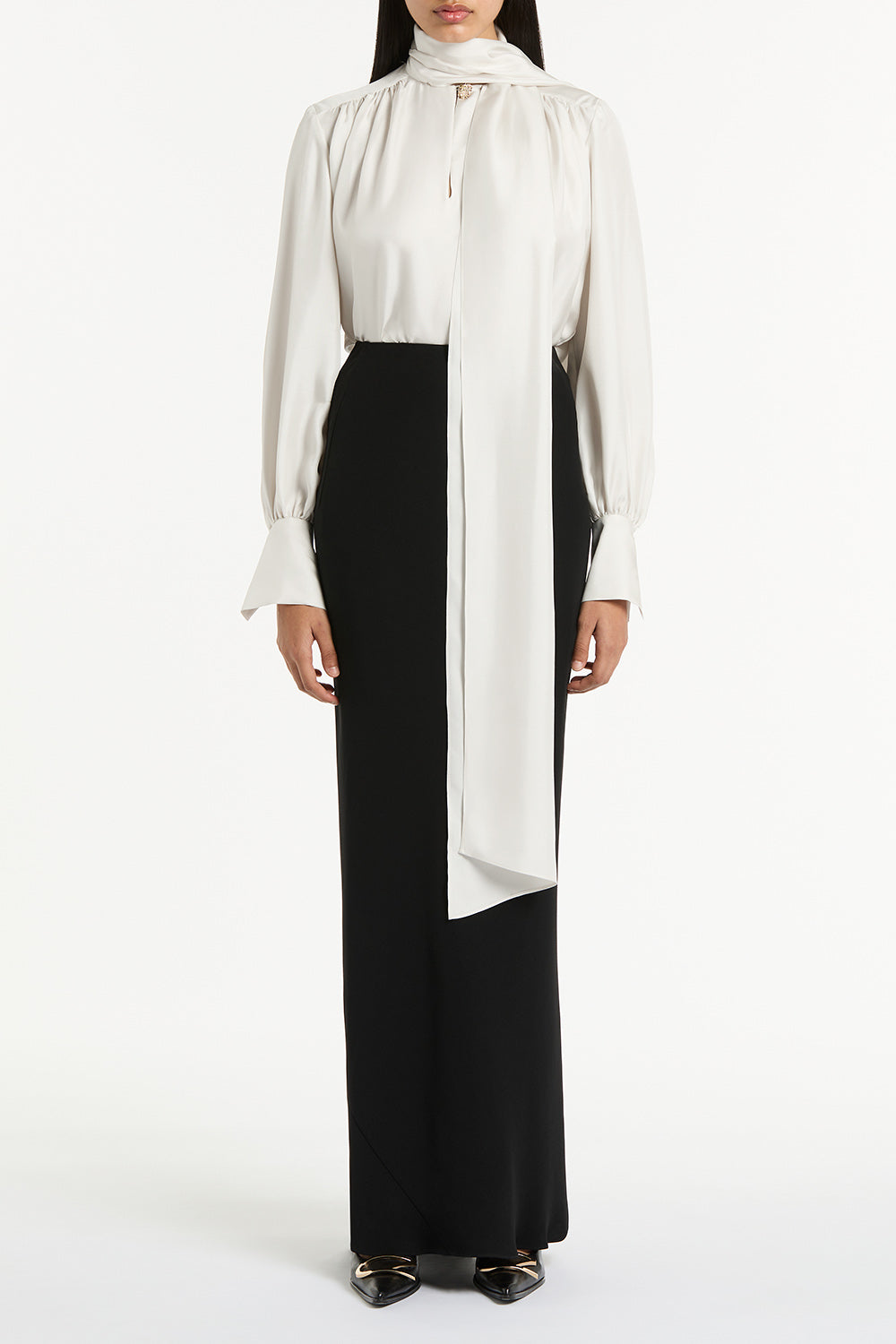 Image of a model wearing Skirts. Product name - Black Crepe Bias Skirt in Black colour by brand - Carla Zampatti