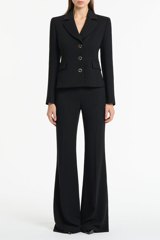 Image of a model wearing Pants. Product name - Black Crepe Bootleg Pant in Black colour by brand - Carla Zampatti