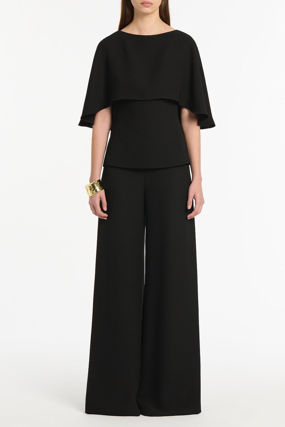 Image of a model wearing Tops. Product name - Black Crepe Cape Top in Black colour by brand - Carla Zampatti